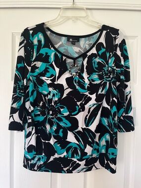 Floral print blouse with decorative circle ring detail